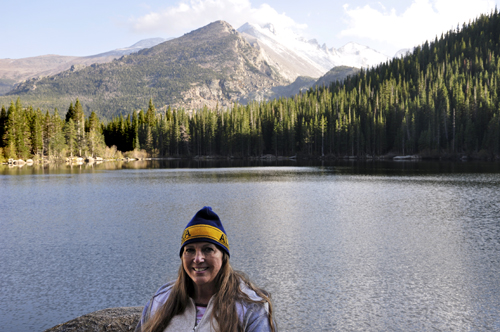 Karen Duquette at Bear Lake with Longs Peak in the background